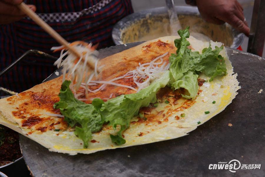 西安煎餅夫妻 9年堅(jiān)持為特殊群體提供免費(fèi)煎餅（組圖）